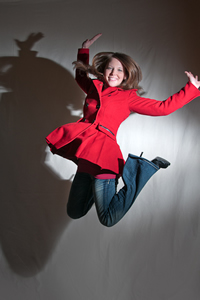 senior portrait, action, jumping, red coat